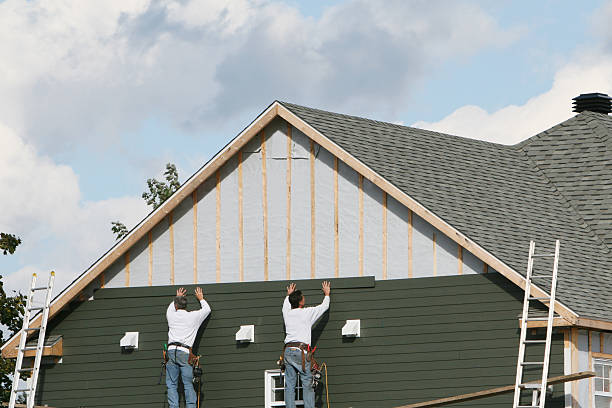Professional Storm Damage Siding Repair technician working in Woodstock, OH